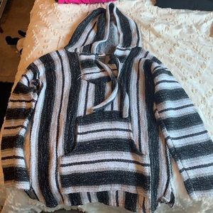 Black, grey, and white “drug rug”